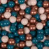 A close-up, overhead view of a pile of colorful plastic balls. Voir les images du produit