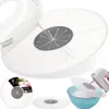 A collage of images showing a splash guard for mixers and blenders, including a close-up of the product, a packaged product, and the product in use with a mixer over a bowl of flour. Produktbild-Vorschau