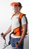 A person wearing a harness and face shield, holding a string trimmer. Produktbild-Vorschau