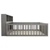 A side view of a grey wooden crib with a built-in bookshelf at the headboard. Produktbild-Vorschau
