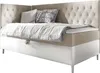 A boxspring bed with tufted headboard and pillows on it. Náhľad obrázku produktu