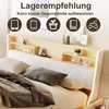 A bed with a headboard featuring storage shelves and decorative items. Produktbild-Vorschau