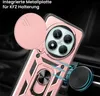 A close-up view of a rose gold phone case with a camera lens cover and a ring holder, shown attached to a car vent mount. Produktbild-Vorschau