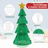 A diagram showing a Christmas tree with various accessories and text labels, set against a snowy background with cartoonish elements. Náhled obrázku produktu