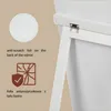 Close-up of a white stand mirror, showing a hinge and a textured circle with text describing anti-scratch foil. Náhľad obrázku produktu