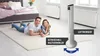 A couple is lying on a rug in a bedroom next to a tower fan. Produktbild-Vorschau