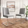 Two gray dining chairs with silver metal legs are shown in a room with wooden floors and a painting on the wall. Produktbild-Vorschau