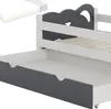 A close-up view of a children's bed with a pull-out drawer and a mattress. Anteprima dell’immagine prodotto