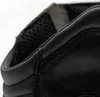 A close-up view of the top edge of a black leather boot. Podgląd zdjęcia produktu