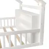 A close-up view of a white wooden children's bed frame with a built-in bookshelf. Produktbild-Vorschau