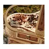 A close-up view of a detailed wooden 3D puzzle shaped like a piano, with intricate carvings and a flower-like centerpiece. Podgląd zdjęcia produktu