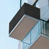A close-up view of a modern building's balcony with a dark gray privacy screen. Produktbild-Vorschau