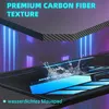 A close-up view of a gaming desk surface with a carbon fiber texture and glowing blue accents, with water splashing on it. Voir les images du produit