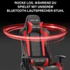 A gaming chair with red accents and a red light effect swirling around it. Produktbild-Vorschau
