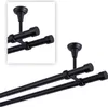 A close-up view of a black double curtain rod mounted on a ceiling. Produktbild-Vorschau