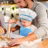 A father and child are baking together in a kitchen. Voir les images du produit