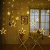 Star-shaped string lights are hung in a room with a window and a table with chairs. Produktbild-Vorschau