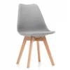 A light gray dining chair with wooden legs against a white background. Podgląd zdjęcia produktu