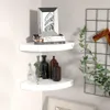 Two white corner shelves mounted on a light gray wall, decorated with books, a picture frame, and decorative bottles. Voir les images du produit