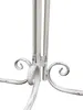 Close-up of the base of a vintage-style metal table with decorative scrollwork. Produktbild-Vorschau