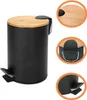 A black pedal bin with a bamboo lid, shown from different angles. Produktbild-Vorschau