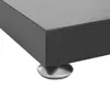 A close-up view of the bottom corner of a black stand, showing a silver foot. Podgląd zdjęcia produktu