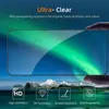 A hand is shown holding a screen protector over a phone screen displaying an aurora borealis. Below the phone screen are icons and text describing features. Voir les images du produit