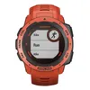 A close-up, front-facing view of an orange Garmin Instinct Solar smartwatch with a black bezel and a screen displaying activity options. Produktbild-Vorschau