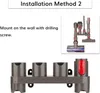 Instructional image showing a wall-mounted accessory holder for a vacuum cleaner. Produktbild-Vorschau