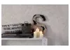 A shelf with decorative items including a large letter 'S', candles, and a burlap sack with text. Podgląd zdjęcia produktu