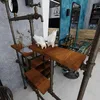 A stylized interior scene with industrial-style shelving and decor. Produktbild-Vorschau