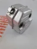 A metal muffler for a chainsaw is shown on a white surface. Produktbild-Vorschau