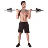 A man is holding a barbell with weights. Náhled obrázku produktu