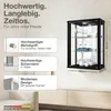 A wall-mounted display cabinet with items inside, shown on a wall above a cabinet. Text callouts describe features. Produktbild-Vorschau