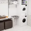 A laundry room with a sink, washing machine, dryer, and storage baskets. Produktbild-Vorschau