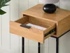 A close-up of a wooden bedside table with an open drawer. Produktbild-Vorschau