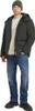 A man wearing a jacket, beanie, and jeans. Produktbild-Vorschau