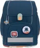 A dark blue children's backpack with space-themed patches and a UFO charm. Voir les images du produit