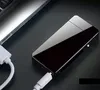 A black electronic plasma lighter is connected to a laptop via a USB cable. Podgląd zdjęcia produktu
