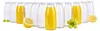 A set of glass bottles, some filled with yellow juice and others empty, arranged with grapes and lemon slices. Podgląd zdjęcia produktu