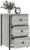 A gray wood-grain finish nightstand with three drawers and black metal accents, shown against a white background. A small alarm clock and a vase of greenery sit on top. Produktbild-Vorschau