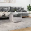 A living room scene with a gray sofa and a gray coffee table. Produktbild-Vorschau