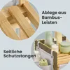 Close-up views of a bamboo laundry basket with storage pockets and shelves, highlighting its features. Produktbild-Vorschau
