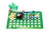 A science experiment kit with a fan, meter, and other components on a green grid base. Podgląd zdjęcia produktu