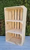 A wooden crate with shelves against a green hedge background. Produktbild-Vorschau