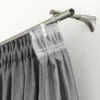 A close-up view of gray curtains hanging from a double curtain rod. Náhled obrázku produktu