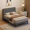 A bedroom scene with a bed, nightstand, and artwork. Náhľad obrázku produktu