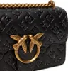 A close-up shot of a black handbag with gold hardware. Náhled obrázku produktu