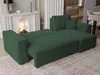 A green sectional sofa is shown in a living room setting with a fireplace in the background. Produktbild-Vorschau