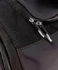 A close-up view of a black bag with two zippers, each with a black tag that has the word "VENUM" printed on it in white. Voir les images du produit